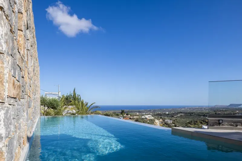 Private infinity pool of Villa ANDRIOTIS with views over Agia Triada to the sea